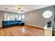 A comfortable living room features a blue sectional sofa at 9527 Southern Charm Cir, Brooksville, FL 34613
