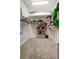 Spacious walk-in closet with custom shelving, ample hanging space, and carpeted floor at 9527 Southern Charm Cir, Brooksville, FL 34613