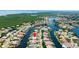 Wide aerial view of the canal community, highlighting the home's location and surrounding waterways at 9810 Compass Point Way, Tampa, FL 33615