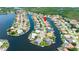Stunning aerial view displays a beautiful home nestled in a tranquil waterfront community with boating access at 9810 Compass Point Way, Tampa, FL 33615