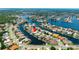 Expansive aerial view of a waterfront community showcasing numerous canals and access to open water at 9810 Compass Point Way, Tampa, FL 33615