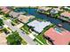 Aerial view of the home showcasing its location along the canal waterfront in a coastal community at 9810 Compass Point Way, Tampa, FL 33615
