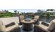 Close up of stylish table and chairs on the deck, offering a cozy spot to enjoy the outdoors and serene water views at 9810 Compass Point Way, Tampa, FL 33615