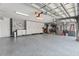 Spacious three car garage with epoxy flooring, great storage and organization. Ready for your cars and hobbies at 9810 Compass Point Way, Tampa, FL 33615
