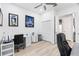 Bright office space featuring sports memorabilia, two desks and a closet at 9810 Compass Point Way, Tampa, FL 33615