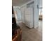 Bright kitchen area showcasing tiled flooring, white refrigerator, and access to living room at 6339 Delaware Ave, New Port Richey, FL 34653