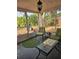Relaxing screened porch with seating, a view of the backyard, and lots of natural light at 6339 Delaware Ave, New Port Richey, FL 34653