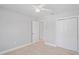Bedroom featuring wood floors, neutral color, and closet with double doors at 1000 Magnolia Dr, Clearwater, FL 33756