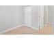 Cozy bedroom featuring light hardwood floors, neutral walls, and a closet at 1000 Magnolia Dr, Clearwater, FL 33756