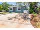 Charming one-story home featuring a well-maintained front yard and a spacious driveway at 1000 Magnolia Dr, Clearwater, FL 33756