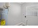 Laundry room featuring water heater, neutral color, and flooring at 1000 Magnolia Dr, Clearwater, FL 33756