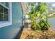 This home features meticulous side yard landscaping, lush green foliage and a well-maintained fence at 1000 Magnolia Dr, Clearwater, FL 33756