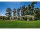 A welcoming entrance to Fox Wood at Trinity with manicured landscaping and signage under a blue sky at 10344 Tecoma Dr, Trinity, FL 34655