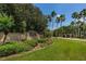Well-manicured entrance to Trinity community with lush landscaping and signage at 10344 Tecoma Dr, Trinity, FL 34655