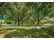 Community park with a wide sidewalk, and lush greenery, offering a peaceful retreat in a residential area at 10344 Tecoma Dr, Trinity, FL 34655
