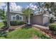 Charming single-Gathering home features a well-manicured lawn and lush garden under a bright sunny sky at 10344 Tecoma Dr, Trinity, FL 34655