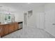 Kitchen features a breakfast bar with stainless steel dishwasher and sink at 10344 Tecoma Dr, Trinity, FL 34655