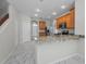 Kitchen features granite counters, stainless appliances, and white marble-patterned tile floors at 10344 Tecoma Dr, Trinity, FL 34655