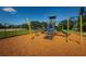 Modern playground featuring climbing structures, slides, and swings on a woodchip safety surface for hours of active play at 10344 Tecoma Dr, Trinity, FL 34655