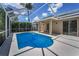 Screened pool with clear blue water and a covered patio for outdoor living and relaxation at 10344 Tecoma Dr, Trinity, FL 34655