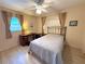 Cozy bedroom featuring a comfortable bed, ample closet space, and a bright atmosphere at 10431 Syringa Ct, Port Richey, FL 34668
