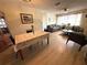 Open-concept layout combines the dining and living areas, perfect for entertaining and gatherings at 10431 Syringa Ct, Port Richey, FL 34668