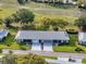 An aerial view showcases this lovely home with a well-maintained yard in a charming neighborhood at 11141 Sandtrap Dr # 11141, Port Richey, FL 34668