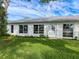 Backyard view of the exterior of the home at 11141 Sandtrap Dr # 11141, Port Richey, FL 34668