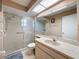 Bright bathroom with glass shower doors and a marble countertop at 11141 Sandtrap Dr # 11141, Port Richey, FL 34668
