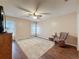 Bright bedroom featuring a ceiling fan, hardwood floors and plenty of space at 11141 Sandtrap Dr # 11141, Port Richey, FL 34668