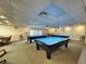 Well-lit community billiards room with multiple pool tables, providing residents a space for leisure and recreation at 11141 Sandtrap Dr # 11141, Port Richey, FL 34668