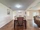 Open dining room features a table with seating for six and hardwood floors at 11141 Sandtrap Dr # 11141, Port Richey, FL 34668