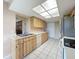 The kitchen features stainless steel appliances and a dual basin sink at 11141 Sandtrap Dr # 11141, Port Richey, FL 34668