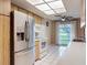 The kitchen features a ceiling fan and stainless steel refrigerator at 11141 Sandtrap Dr # 11141, Port Richey, FL 34668