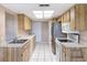 The kitchen has stainless steel appliances and lots of cabinet space at 11141 Sandtrap Dr # 11141, Port Richey, FL 34668
