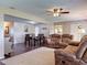 Comfortable living space showcasing a plush sofa, modern entertainment center, and large windows at 11141 Sandtrap Dr # 11141, Port Richey, FL 34668
