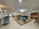 Well-lit lobby area featuring comfortable seating, tiled floors, and decorative artwork at 11141 Sandtrap Dr # 11141, Port Richey, FL 34668