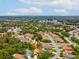 Overhead view of property, nestled in a community surrounded by mature trees and winding neighborhood streets at 11350 Copley Ct, Spring Hill, FL 34609