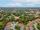 Aerial view of property showcasing its location within a community surrounded by lush greenery and neighborhood streets at 11350 Copley Ct, Spring Hill, FL 34609