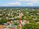 Aerial view of the property, highlighting its location in a verdant, tree-lined community with nearby roads at 11350 Copley Ct, Spring Hill, FL 34609