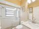 Bathroom featuring a glass enclosed shower, toilet, and single sink vanity at 11350 Copley Ct, Spring Hill, FL 34609