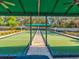 Bocce ball court surrounded by garden and shaded by a permanent roof at 11350 Copley Ct, Spring Hill, FL 34609