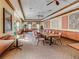 Spacious dining area with tables and chairs, perfect for community meals and social events at 11350 Copley Ct, Spring Hill, FL 34609