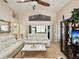 Bright living room featuring vaulted ceilings, wood floors, and comfortable leather furniture at 11350 Copley Ct, Spring Hill, FL 34609