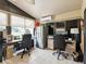 Bright and airy office with a refrigerator and separate desk areas at 11350 Copley Ct, Spring Hill, FL 34609