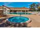 Resort-style pool and hot tub area surrounded by comfortable lounge chairs for relaxation at 11350 Copley Ct, Spring Hill, FL 34609