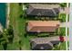 Aerial view features a home bordered by a well manicured lawn at 11611 Callisia Dr, Odessa, FL 33556