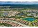 Aerial view showcases the community's lush landscaping and beautiful lakes at 11611 Callisia Dr, Odessa, FL 33556