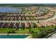 Community aerial shot showcasing the lake, manicured landscaping, and common areas designed for community interaction at 11611 Callisia Dr, Odessa, FL 33556