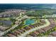 Panoramic aerial view of a residential area with tree-lined streets, perfect for walking and biking, surrounded by a greenbelt at 11611 Callisia Dr, Odessa, FL 33556